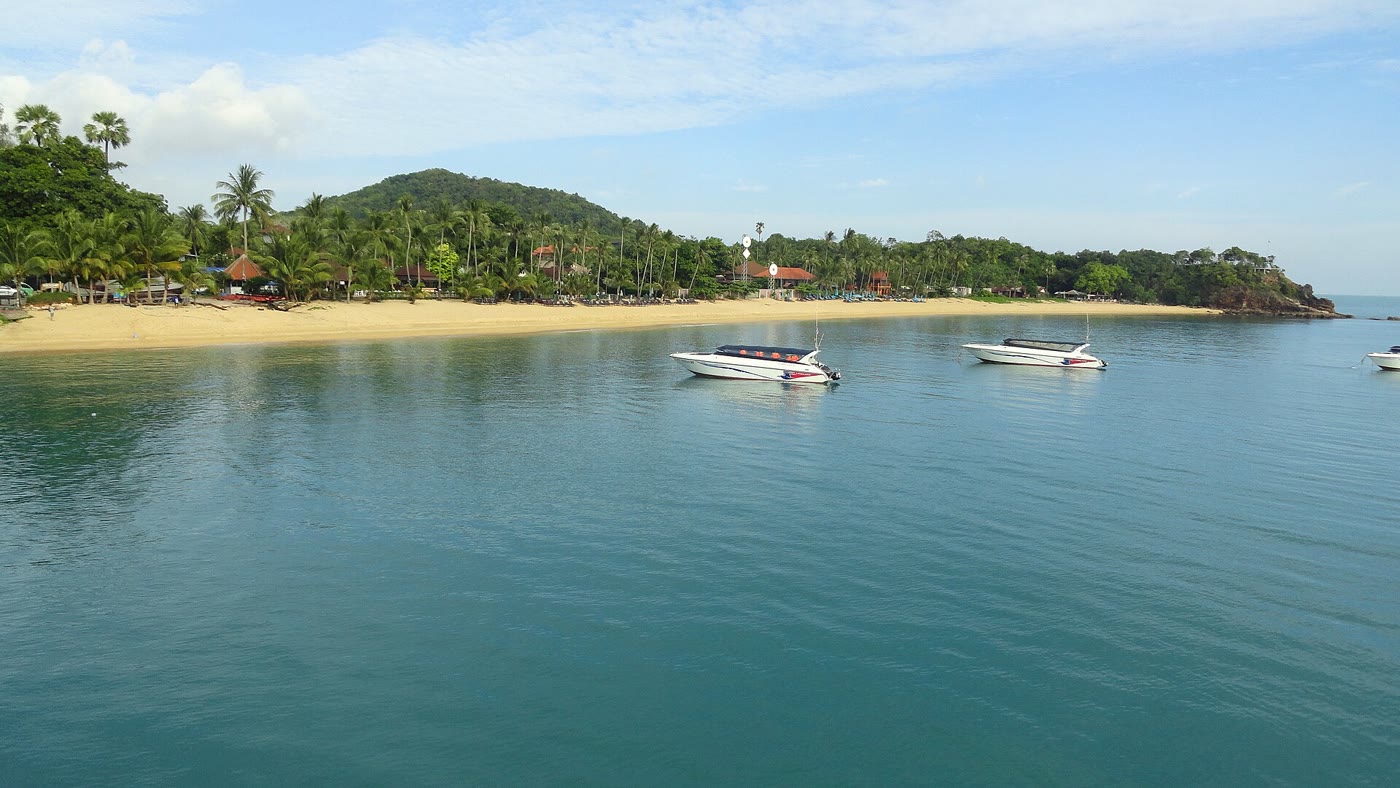 Maenam Beach, Koh Samui, a long quiet stretch of sand with long-tail boats offshore